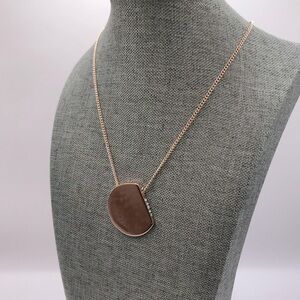 Chico’s Rose Gold Sliding Pendant Necklace.